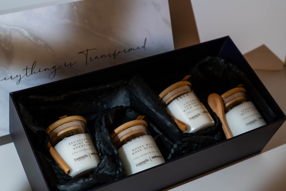 Incanto set of four 3.5 oz candles in a black gift box, with wooden lids and spoons