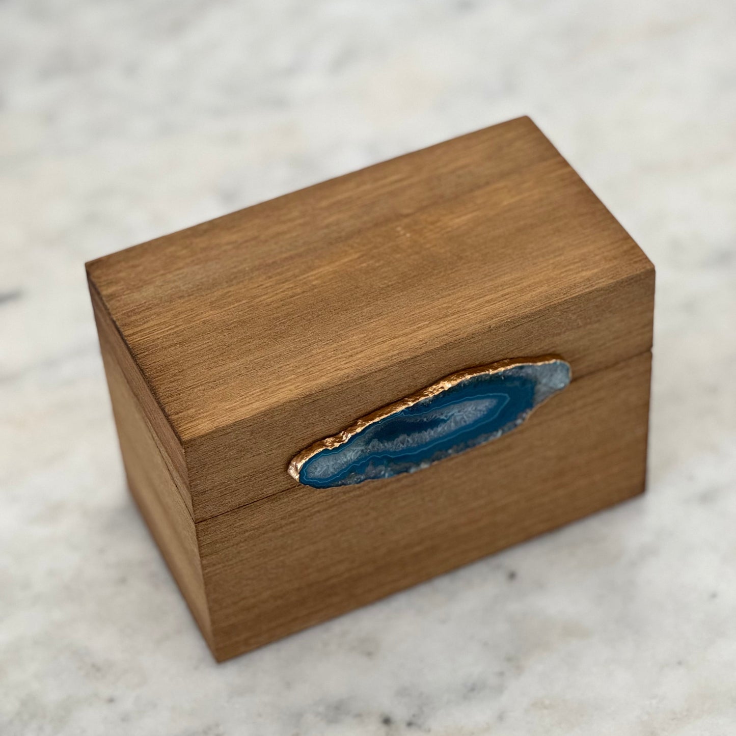 Wooden-style box with natural stone