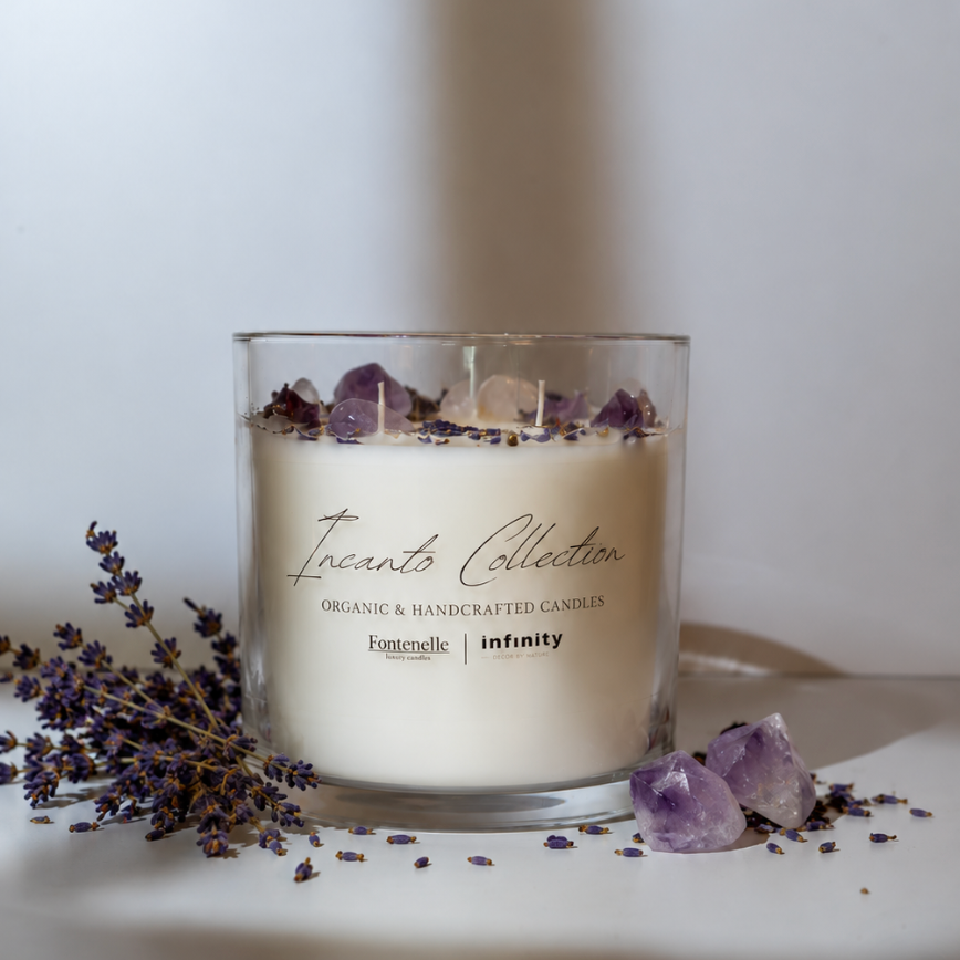 Incanto Luce 55 oz centerpiece candle with dried lavender and amethyst stones in a clear glass vessel